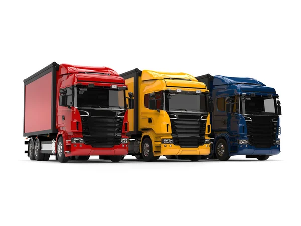 Heavy transport trucks - red, blue and yellow — Stock Photo, Image