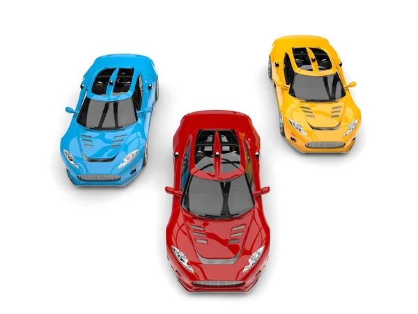 Сучасні супер гоночні автомобілі в основних кольорах вид зверху — стокове фото