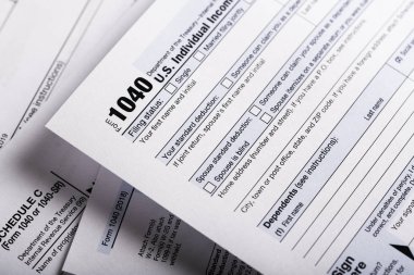 A stack of United States tax forms for individuals. 