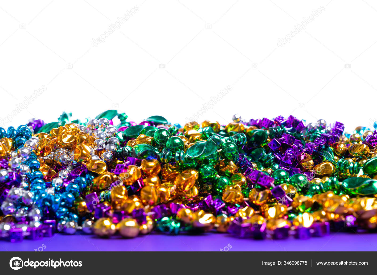 Mardi Gras beads on white background Stock Photo by ©miflippo 346098778