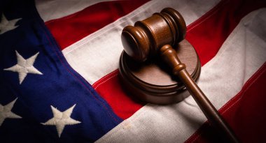 Judges gavel and an American flag -justice theme