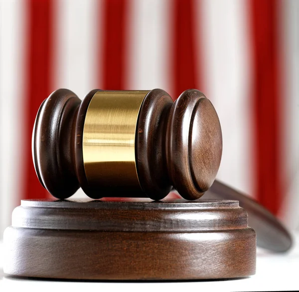Judges gavel and an American flag -justice theme — Stok fotoğraf