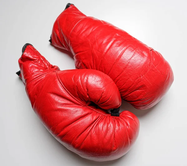 A set of red boxing gloves on a white background — Stockfoto