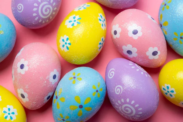 Painted Easter eggs on a colorful background — Stock Photo, Image