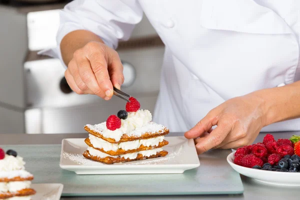 Pastry chef decorating