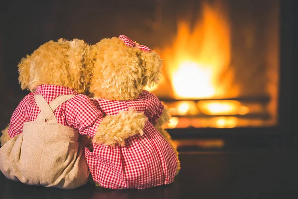 Teddy bears in  fireplace — Stock Photo, Image