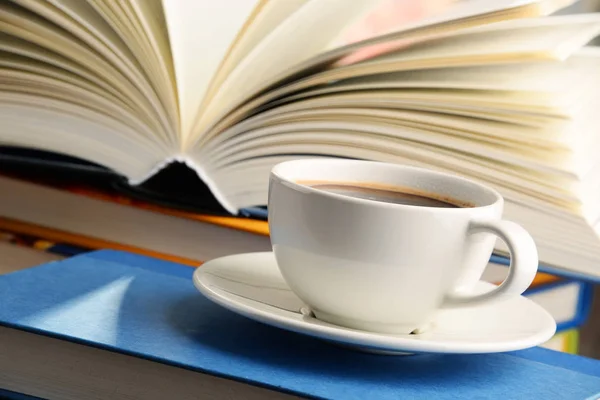 Composition with books and cup of coffee — Stock Photo, Image