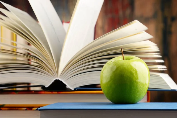 Composition with hardcover books and apple — Stock Photo, Image