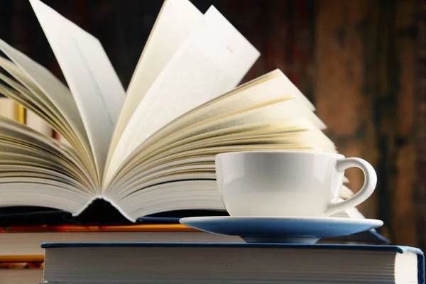 Composition with books and cup of coffee — Stock Photo, Image