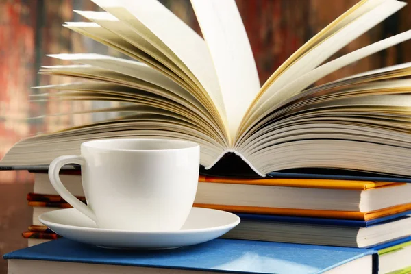 Composition with books and cup of coffee — Stock Photo, Image