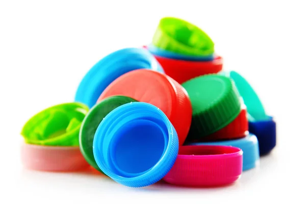 Composizione con tappi di plastica colorati — Foto Stock