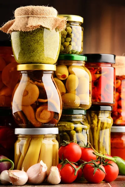 Jars with variety of pickled vegetables. — Stock Photo, Image