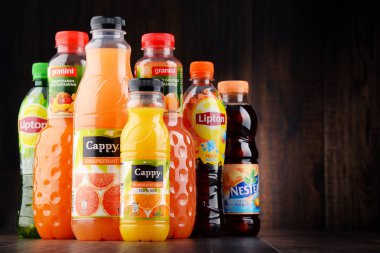 Bottles of assorted fruit juices clipart