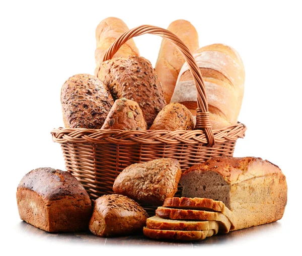 Wicker basket with assorted baking products isolated on white — Stock Photo, Image