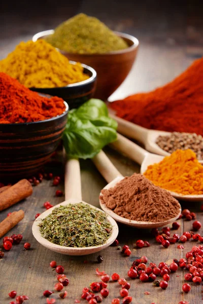 Variety of spices on kitchen table — Stock Photo, Image