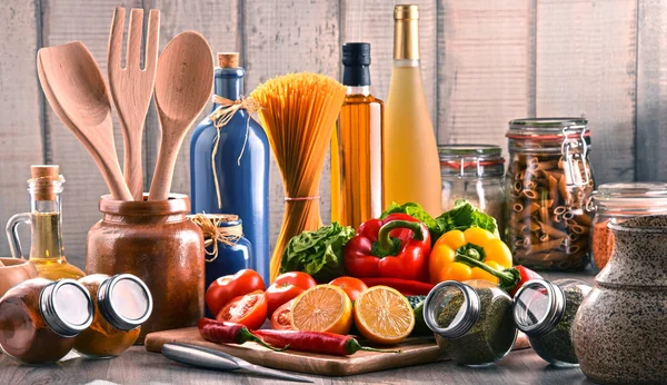 Composition with assorted food products and kitchen utensils — Stock Photo, Image