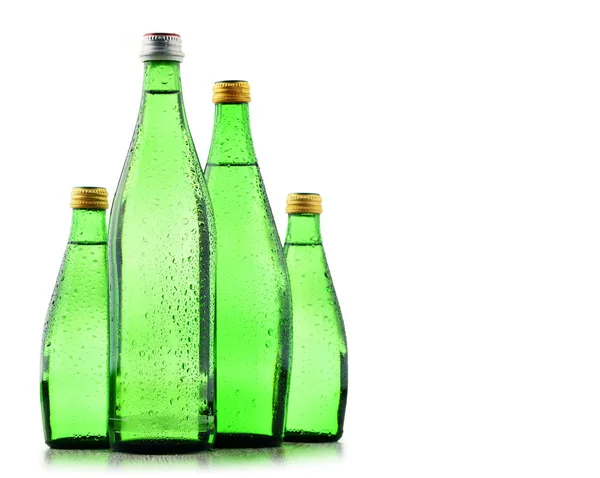 Glass bottles of mineral water isolated on white — Stock Photo, Image