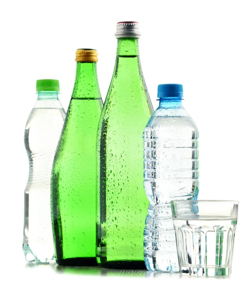 Glass and plastic bottles of mineral water isolated on white — Stock Photo, Image