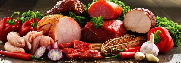 Variety of meat products including ham and sausages — Stock Photo, Image