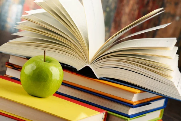 Composition with hardcover books and apple — Stock Photo, Image