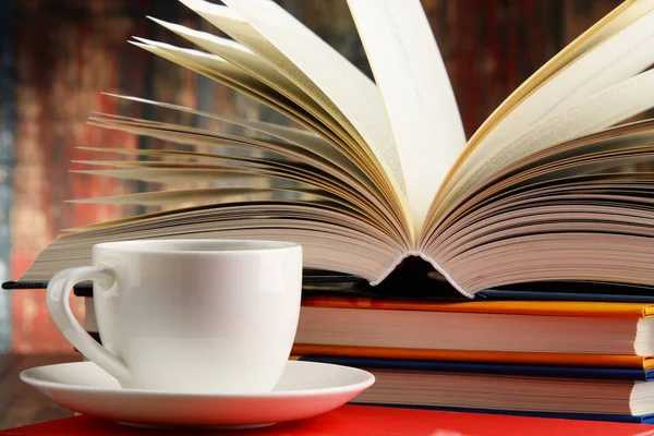 Composition with books and cup of coffee — Stock Photo, Image