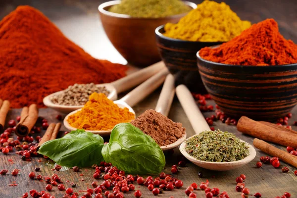 Variety of spices on kitchen table — Stock Photo, Image