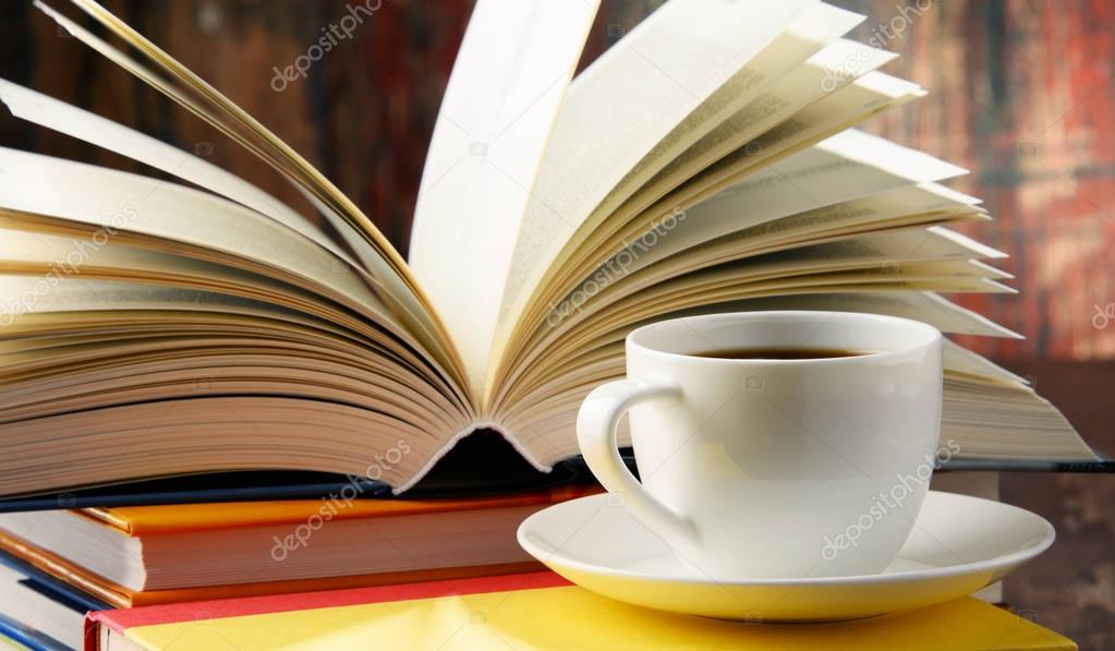 Composition with books and cup of coffee