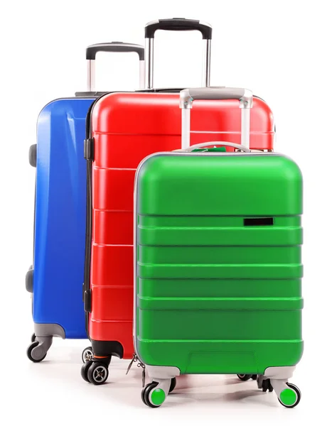 Five plastic suitcases isolated on white — Stock Photo, Image