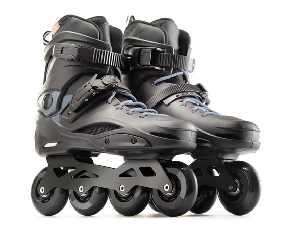 Par de patins inline pretos isolados em branco — Fotografia de Stock