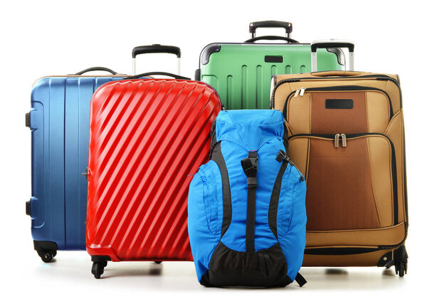 Suitcases and rucksacks isolated on white