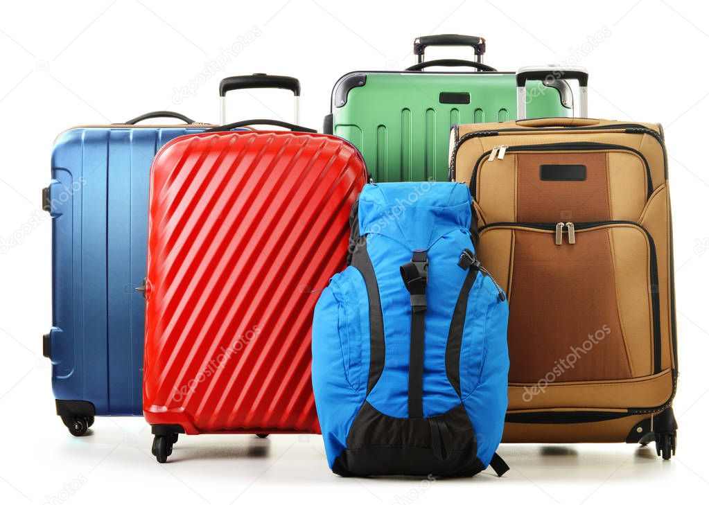 Suitcases and rucksacks isolated on white