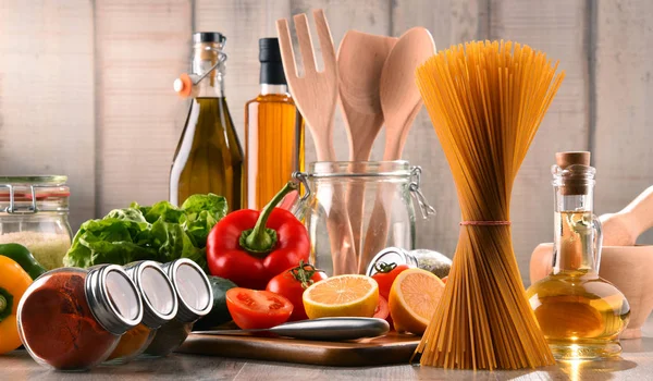 Composition with assorted food products and kitchen utensils