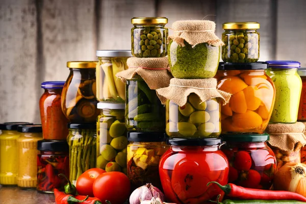 Jars with variety of pickled vegetables. — Stock Photo, Image