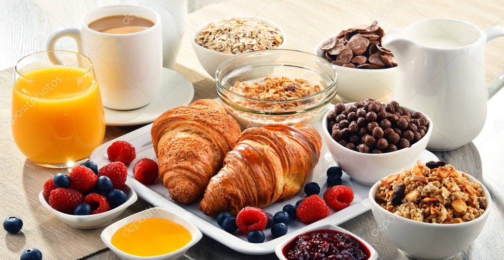 Breakfast served with coffee, juice, croissants and fruits