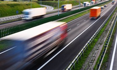 Trucks on four lane controlled-access highway in Poland clipart