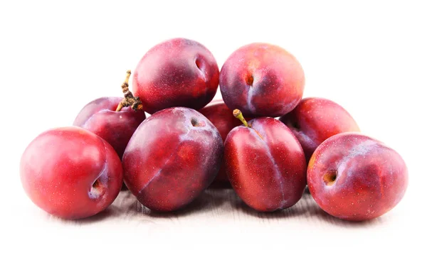 Composition with plums isolated on white background — Stock Photo, Image