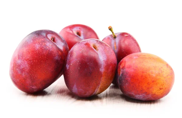 Composition with plums isolated on white background — Stock Photo, Image