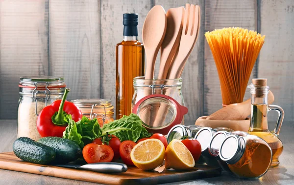 Composition with assorted food products and kitchen utensils — Stock Photo, Image