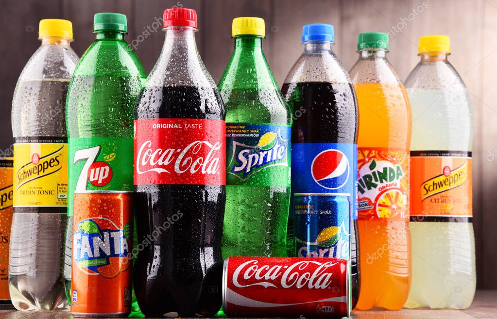 POZNAN, POLAND - DEC 15, 2017: Bottles of global soft drink brands including products of Coca Cola Company and Pepsico