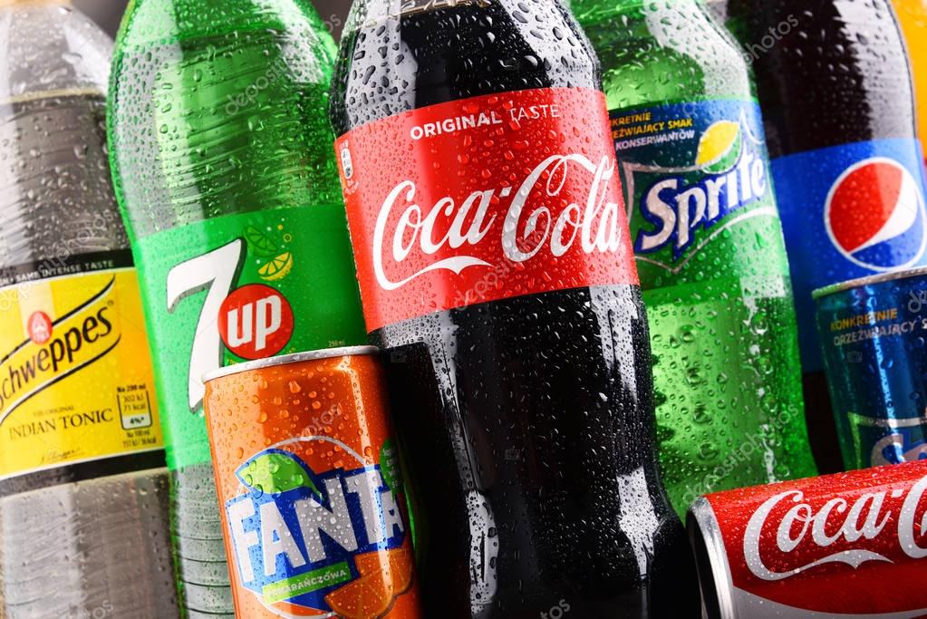 POZNAN, POLAND - DEC 15, 2017: Bottles of global soft drink brands including products of Coca Cola Company and Pepsico