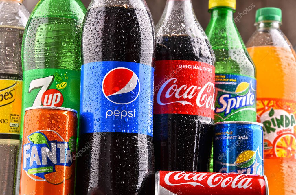 POZNAN, POLAND - DEC 15, 2017: Bottles of global soft drink brands including products of Coca Cola Company and Pepsico