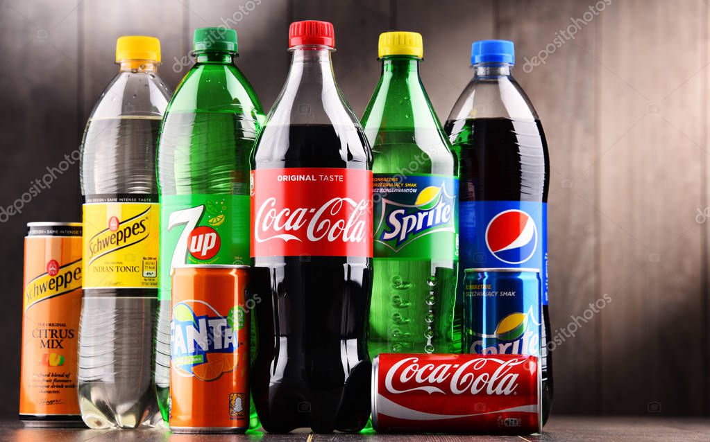 POZNAN, POLAND - DEC 15, 2017: Bottles of global soft drink brands including products of Coca Cola Company and Pepsico