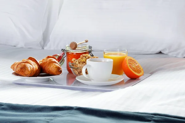 Breakfast in bed in hotel room.