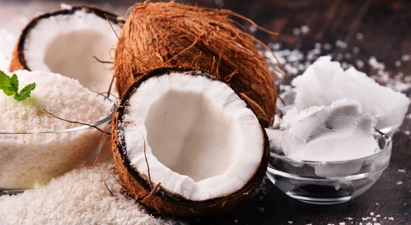 Composition with bowl of shredded coconut and shells