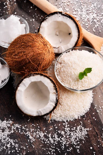 Composition with bowl of shredded coconut and shells