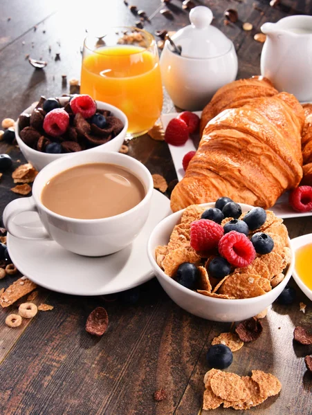 Breakfast served with coffee, juice, croissants and fruits — Stock Photo, Image
