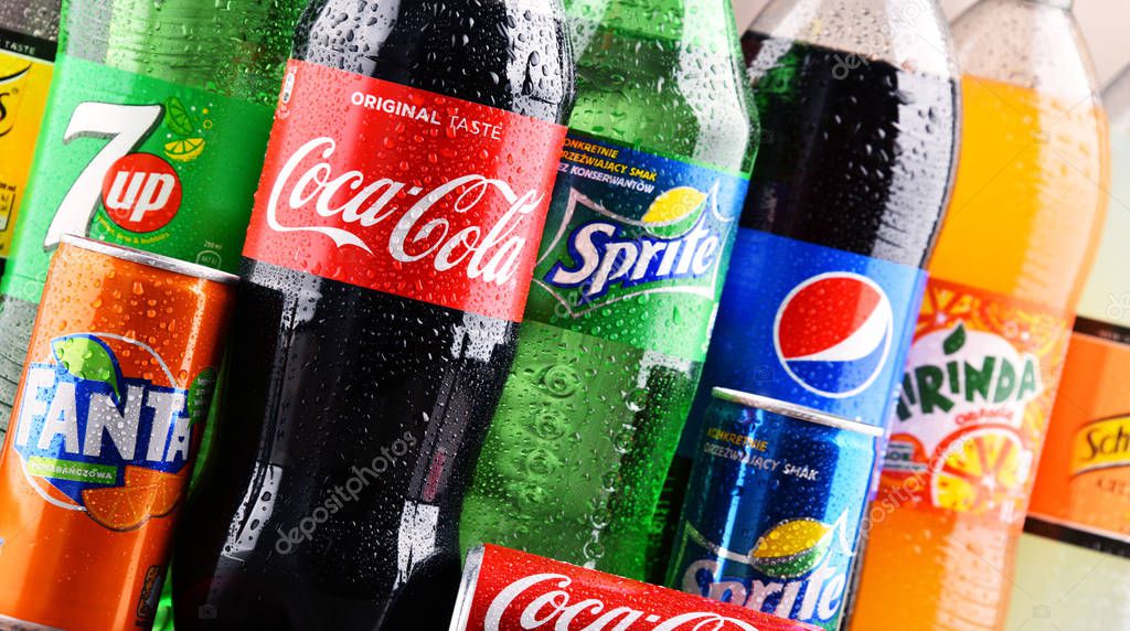 POZNAN, POLAND - DEC 15, 2017: Bottles of global soft drink brands including products of Coca Cola Company and Pepsico