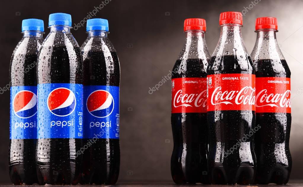 POZNAN, POLAND - MAR 1, 2018: Plastic bottles of Coca Cola and Pepsi, brands of two leading competitors on global soft drinks market
