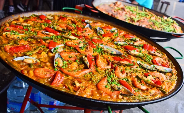 Spanish paella prepared in the street restaurant — Stock Photo, Image