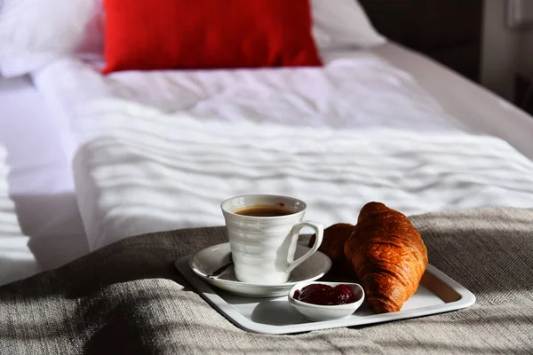 Breakfast in bed in hotel room